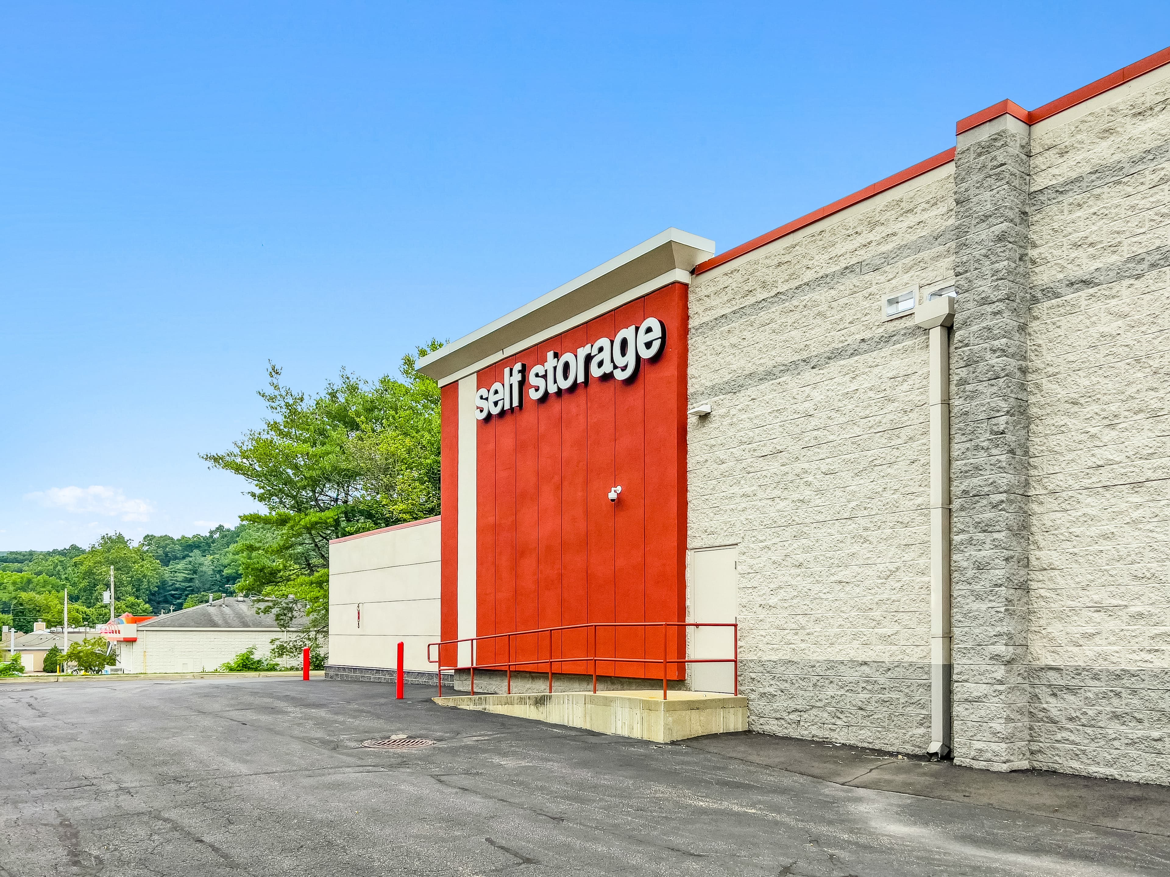 Exterior of Jefferson Valley Self Storage with self-storage signage.